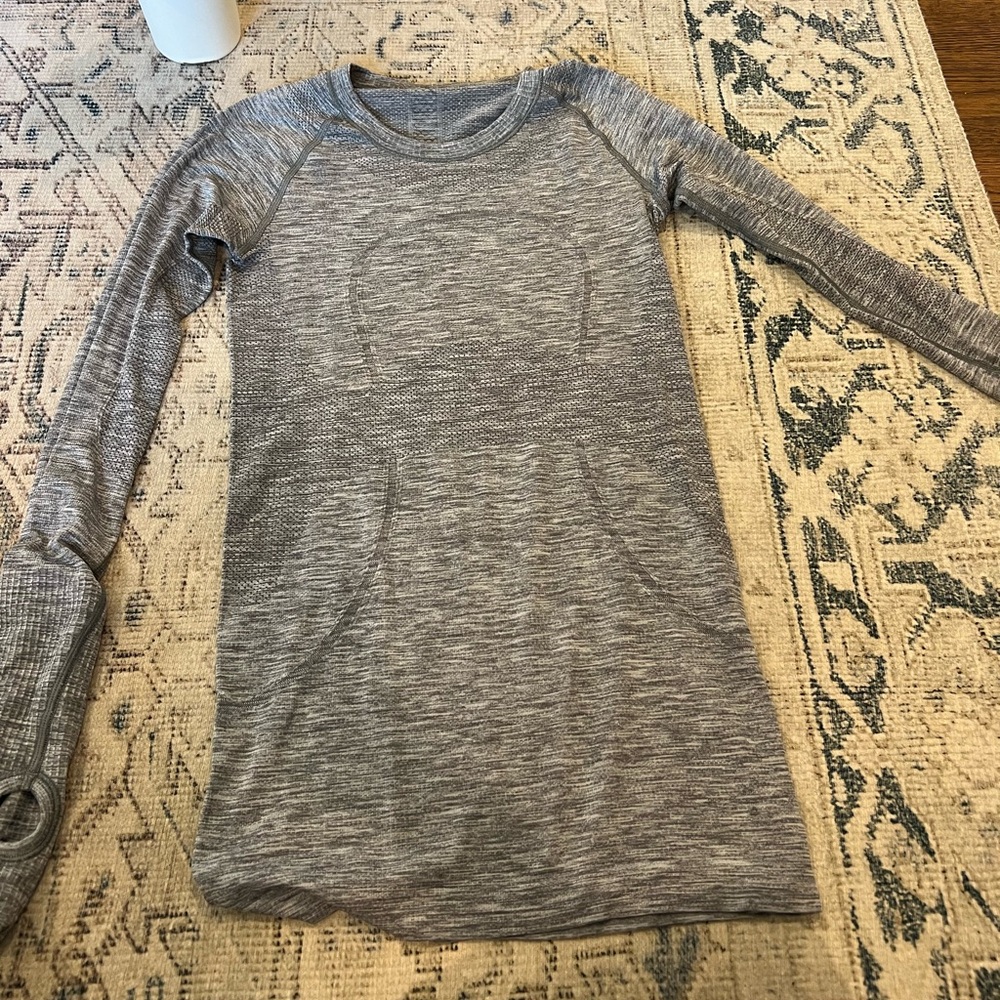 Gray swiftly tech. No tags. Size 2. Good used condition.